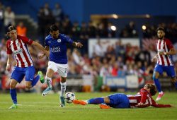 Antoine Griezmann of Atletico Madrid tackles Riyad Mahrez of Leicester City