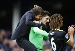 Chelsea manager Antonio Conte jumps onto the back of Thibaut Courtois as the team celebrates victory at full time in the Premier League match between Everton and Chelsea played at Goodison Park, Liverpool on the 30th April, 2017