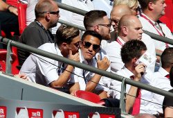Mesut Ozil and Alexis Sanchez of Arsenal watch on from the stands.