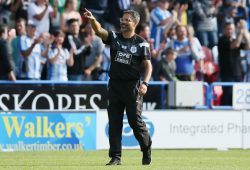 Huddersfield Town manager David Wagner pints to the crowd at the end of the match