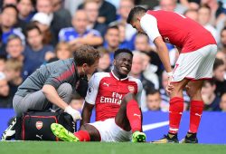 Danny Welbeck of Arsenal looks in pain as he receives treatment.