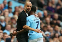 Manchester City manager Pep Guardiola hugs Raheem Sterling