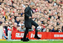 Manchester United manager Jose Mourinho controls the match ball