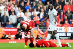 Romelu Lukaku of Manchester United reacts after colliding with Dejan Lovren of Liverpool