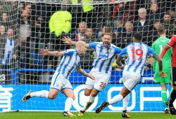 Aaron Mooy of Huddersfield Town celebrates scoring the opening goal