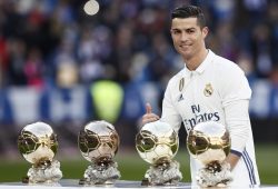 epa05703181 Real Madrid's Portuguese forward Cristiano Ronaldo poses with his four Ballon d'Or trophies prior to the start of their Spanish Primera Division League's soccer match against Granada at the Santiago Bernabeu stadium in Madrid, Spain, 07 January 2017. Ronaldo dedicated his Ballon d'Or 2016 to the fans of Real Madrid in a short ceremony before the match.  EPA/Mariscal