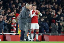 Arsenal manager Arsene Wenger talks with Mesut Ozil of Arsenal