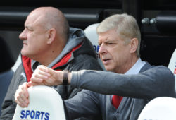 Manager Arsene Wenger of Arsenal sits on the bench before the warm up with his coaching staff