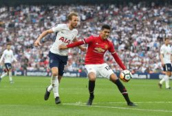 Harry Kane of Tottenham Hotspur battles with  Chris Smalling of Manchester United