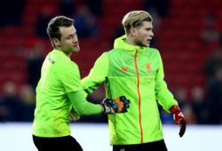 Loris Karius of Liverpool, dropped from the starting XI, and Simon Mignolet of Liverpool, his replacement, hug after warming up