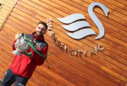 Angel Rangel of Swansea City on the Carabao Cup Trophy at the Swansea City Training Academy