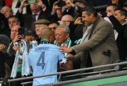 Manchester City's Vincent Kompany shakes hands with Chairman Khaldoon Al Mubarak