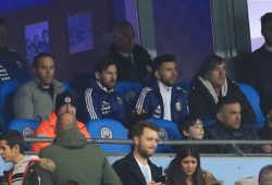 Lionel Messi and Sergio Aguero of Argentina look on from the stand