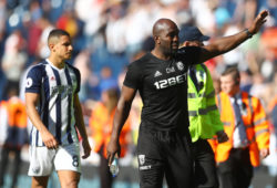 Jake Livermore and West Bromwich Albion caretaker manager Darren Moore applaud the fans at full time