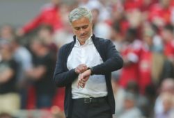 Manchester United manager Jose Mourinho checks his watch