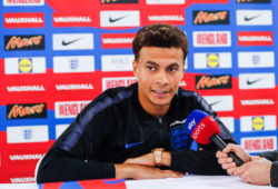 Dele Alli talks to the media during a press conference which included every England squad player at St Georges Park