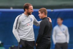 England manager Gareth Southgate has a  laugh  with Groundsman who switched sprinkler system on drenching  him