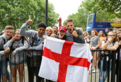 German tourists with England flag supporting the England football team, outside Downing Street. Later today, England plays Croatia in the second FIFA World Cup semi-finals. The winners will play France in the finals on Sunday 15 July 2018 in Luzhniki Stadium.