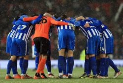 Brighton & Hove Albion team huddle ahead of the game