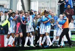 Tom Ince of Huddersfield Town celebrates scoring the opening goal with his team-mates and manager David Wagner