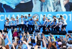 Manchester City lift the Premier League trophy on stage