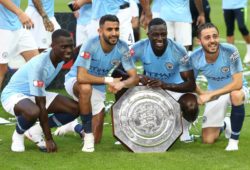 Claudio Gomes  Riyad Mahrez, Benjamin Mendy  and  Bernardo Silva of Manchester City  pose for pictures with Community Shield after the match