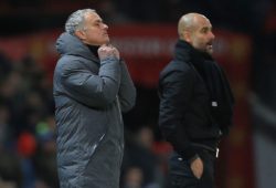 Manchester United manager Jose Mourinho adjusts his coat alongside Manchester City manager Josep Guardiola