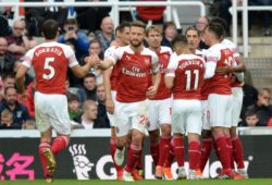 Mesut Ozil of Arsenal ( right) celebrates scoring their second goal with team mates