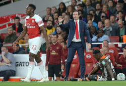 Arsenal manager Unai Emery seems to  ask for calm from Danny Welbeck of Arsenal after he is shown a yellow card
