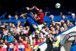 Eden Hazard of Chelsea and Ashley Young of Manchester United challenge for the ball