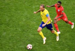 4.07648472 5581464 07.07.2018 Sweden's Andreas Granqvist, left, and England's Raheem Sterling struggle for a ball during the World Cup quarterfinal soccer match between Sweden and England, at the Samara Arena, in Samara, Russia, July 7, 2018.  Maksim Blinov / Sputnik 
IBL
