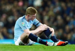 Kevin De Bruyne of Manchester City holds his painful knee