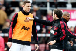 Nemanja Matic of Manchester United speaks with team mate Juan Mata.