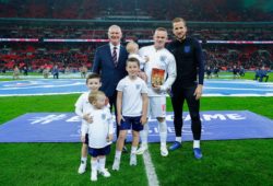 Wayne Rooney poses alongside his four sons and Harry Kane and FA Chairman Greg Clarke as he is presented with a trophy to commemorate his 120 caps for England