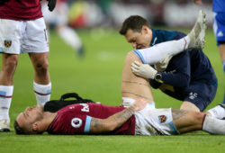Marko Arnautovic of West Ham pulls up from a run with a hamstring leg injury and has to leave the field