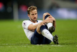 Harry Kane of Tottenham Hotspur holds his ankle & stays down after the final whistle with an injury