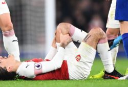 Hector Bellerin of Arsenal screams in pain after suffering a knee injury