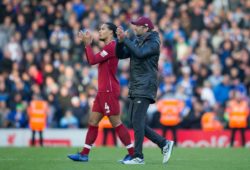 Liverpool manager Jurgen Klopp right applauds supporters as he walks from the pitch alongside defender Virgil van Dijk after the game