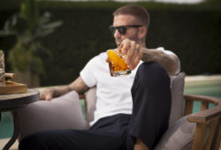 Haig Club has today revealed its latest print campaign, ?Make Your Own Rules?, starring brand partner, David Beckham.  Building on the Haig Club ?Make Your Own Rules? TV commercial released last year, the new print campaign continues to challenge some of the more traditional myths surrounding Scotch, encouraging people of legal purchase age to consider whisky in new ways and occasions. 

Shot by renowned New York fashion photographer Cass Bird, the campaign shoot took place in David?s home city of London, and features a series of three print ads, each with a tag line that challenges a common myth about Scotch.  

The first ad, ?Who says whisky is for quiet nights in?? shows David Beckham with a group of people in a small bar enjoying a lively night out.  The second ad shows David Beckham creating a Haig Club cocktail to challenge the myth that whisky can?t be enjoyed with a mixer.  The final ad presents a different approach to how and where whisky would traditionally be enjoyed, and shows a group of friends including brand partner David Beckham with Haig Club Clubman and cola cocktails by a poolside.

The new campaign images also feature a redesigned brand logo, which includes the creation date 1627 of the historic whisky house, with the Haig heritage going back almost 400 years. 

David Beckham says: ?One of my favourite things about Haig Club is how it dares to be different. With this new campaign we wanted to encourage people to enjoy Scotch the way they want to.  It was a pleasure working with Cass and she perfectly captured the spirit of Haig.? 

Ronan Beirne, Global Brand Director for Haig Club says: ?Our philosophy on Haig Club has always been that our versatile delicious whisky is perfect for making your own rules on how, where & when to enjoy it. This campaign is a continuation of that belief and it was wonderful spending time with David & Cass bringing to life that belief in this campaign.?
