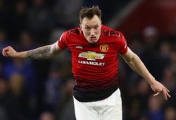 CAPTION CORRECTION Phil Jones of Manchester United pulls a face as he heads the ball