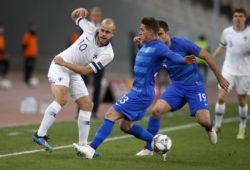 Finland's Teemu Pukki, left, passes the ball as Greece's Leonardo Kourtis, center and Sokratis Papastathopoulos try to stop him during the UEFA Nations League soccer match between Greece and Finland at Olympic stadium in Athens, Thursday, Nov. 15, 2018. (AP Photo/Thanassis Stavrakis)