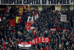 FILE PHOTO: Soccer Football - Premier League - Manchester United vs Manchester City - Old Trafford, Manchester, Britain - December 10, 2017   Manchester United fans before the match    Action Images via Reuters/Carl Recine    EDITORIAL USE ONLY. No use with unauthorized audio, video, data, fixture lists, club/league logos or "live" services. Online in-match use limited to 75 images, no video emulation. No use in betting, games or single club/league/player publications. Please contact your account representative for further details./File Photo