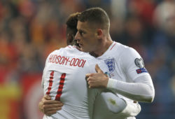 England's Callum Hudson-Odoi, left, hugs teammate Ross Barkley after he scored his side's third goal during the Euro 2020 group A qualifying soccer match between Montenegro and England at the City Stadium in Podgorica, Montenegro, Monday, March 25, 2019. (AP Photo/Darko Vojinovic)