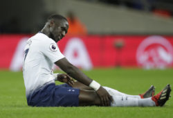 Tottenham's Moussa Sissoko lies on the pitch with an injury before being substituted during the English Premier League soccer match between Tottenham Hotspur and Manchester United at Wembley stadium in London, England, Sunday, Jan. 13, 2019. (AP Photo/Matt Dunham)