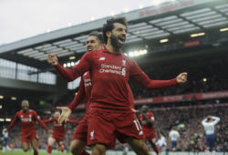 Liverpool's Mohamed Salah, front, and Liverpool's Roberto Firmino celebrate after Tottenham's Toby Alderweireld scores an own goal past his goalkeeper during the English Premier League soccer match between Liverpool and Tottenham Hotspur at Anfield stadium in Liverpool, England, Sunday, March 31, 2019. (AP Photo/Rui Vieira)