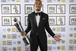 Liverpool's Virgil van Dijk holds the PFA Player of the Year award during the 2019 PFA Awards at the Grosvenor House Hotel, London, Sunday April 28, 2019. Virgil van Dijk has been voted English soccer's player of the year in recognition of his commanding performances in Liverpool's defense as it bids to win the top-flight title for the first time since 1990. (Barrington Coombs/PA via AP)
