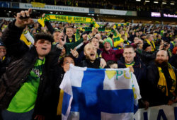 Soccer Football - Championship - Norwich City v Blackburn Rovers - Carrow Road, Norwich, Britain - April 27, 2019   Norwich City's Teemu Pukki celebrates promotion to the premier league with their fans after winning the match   Action Images via Reuters/Adam Holt    EDITORIAL USE ONLY. No use with unauthorized audio, video, data, fixture lists, club/league logos or "live" services. Online in-match use limited to 75 images, no video emulation. No use in betting, games or single club/league/player publications.  Please contact your account representative for further details.