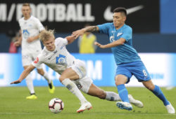 Molde's Erling Braut Haland, left, and Zenit's Matias Kranevitter challenge for the ball during the Europa League play-off round, first leg soccer match between Zenit and Molde at Petrovsky stadium in St. Petersburg, Russia, Thursday, Aug. 23, 2018. (AP Photo/Dmitri Lovetsky)
