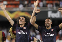 Arsenal midfielder Matteo Guendouzi, left and Arsenal forward Pierre-Emerick Aubameyang celebrate at the end of the Europa League semifinal soccer match, second leg, between Valencia and Arsenal at the Camp de Mestalla stadium in Valencia, Spain, Thursday, May 9, 2019. (AP Photo/Alberto Saiz)