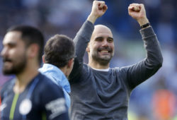 Manchester City coach Pep Guardiola, right, celebrates at the end of the English Premier League soccer match between Brighton and Manchester City at the AMEX Stadium in Brighton, England, Sunday, May 12, 2019. Manchester City defeated Brighton 4-1 to win the championship. (AP Photo/Frank Augstein)